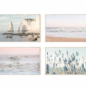 May include: Set of four landscape prints featuring coastal scenes. The first print shows a white cliff with an archway, the second shows a beach with waves crashing on the shore, the third shows a close-up of waves crashing, and the fourth shows a field of lavender.