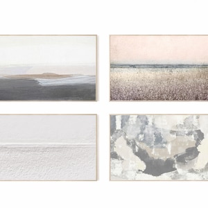 May include: Set of four abstract landscape paintings in muted tones of gray, white, and beige. The paintings are framed in a simple, light wood frame.