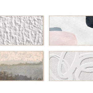 May include: Set of four abstract paintings in wooden frames. The paintings feature a variety of textures and colors, including white, gray, pink, and black.