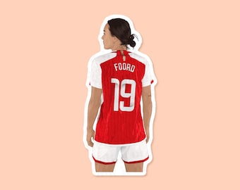 May include: A red and white soccer jersey with the name "FOORD" and the number "19" on the back.