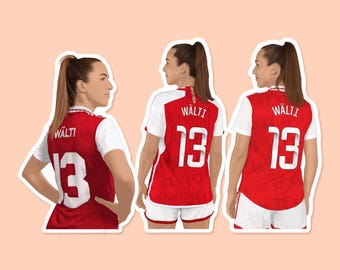 May include: Three red and white soccer jerseys with the name "Wälti" and the number "13" on the back.