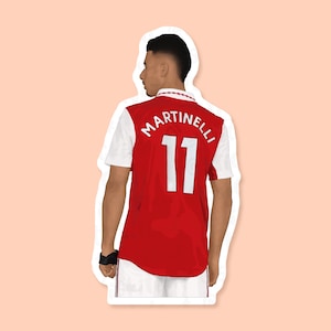 May include: A red and white soccer jersey with the name "MARTINELLI" and the number "11" on the back.