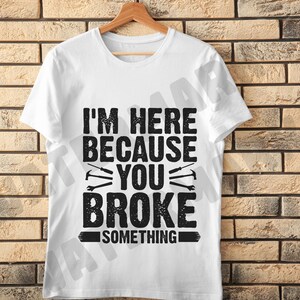 T-shirt Mécanicien 100% Coton - Message Humoristique "Here Because You Broke Something" - Coupe Loose Fit