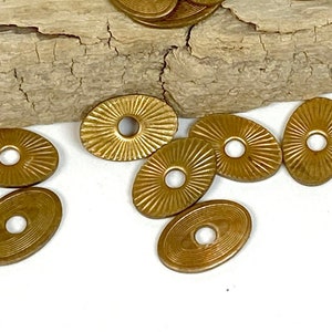 Vintage Brass 1/2&quot; Oval with Sun Pattern & Central Hole: Stamped Metal Assemblage Pieces (Lot of 25)