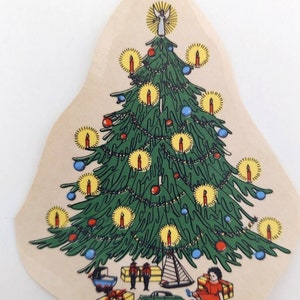 May include: A vintage Christmas tree paper cutout with a green tree, red and blue ornaments, yellow candles, and a star on top.  The tree is surrounded by presents, a toy sailboat, and two figures.