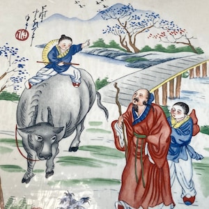 May include: Water-mount decals featuring a colorful illustration of a Chinese scene with a man riding a water buffalo, two men walking, and a bridge over a river. The scene is set against a backdrop of mountains and trees. The decals are made in England and are part of the Color Brite brand.