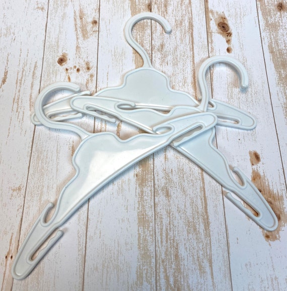 8 White, Molded Plastic Clip on Hangers