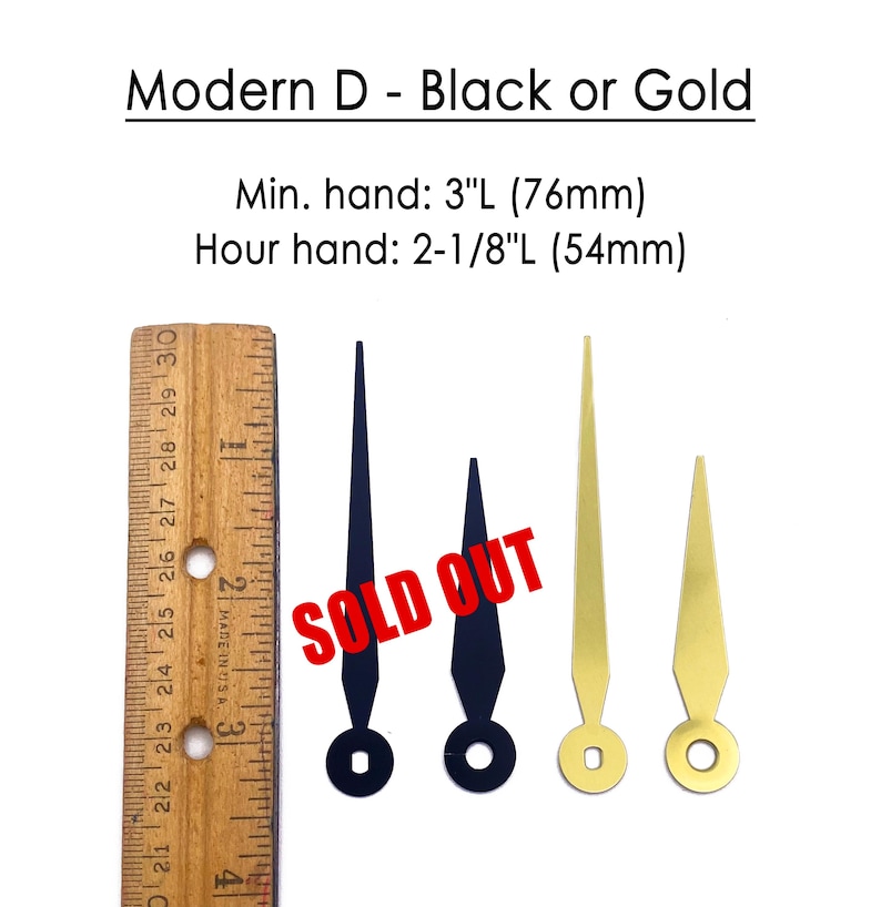 K&ouml;nnte beinhalten: Uhrzeiger in Schwarz und Gold. Das Bild zeigt zwei schwarze und zwei goldene Uhrzeiger mit einem Lineal zur Ma&szlig;stabsbestimmung. Der Text "Modern D - Black or Gold" steht oben. Der Text "SOLD OUT" ist auf das Bild gestempelt.