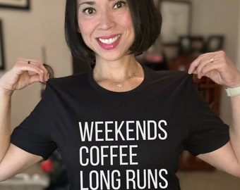 May include: Black t-shirt with white text that reads "Weekends Coffee Long Runs".