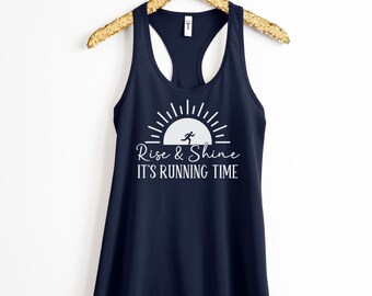 May include: Navy blue tank top with a white graphic of a sunrise and a running person. The text "Rise & Shine It's Running Time" is printed below the graphic.