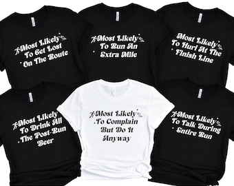May include: Set of six black and white t-shirts with a running theme. Each shirt features a different humorous saying about running, such as "Most Likely To Get Lost On The Route" and "Most Likely To Complain But Do It Anyway".