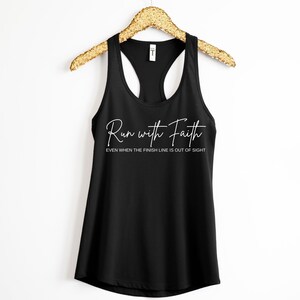 May include: Black tank top with the text "Run with Faith" and the smaller text "Even when the finish line is out of sight" in white.