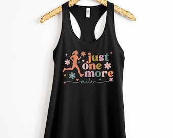 May include: Black tank top with a running woman silhouette and the text "just one more mile" in colorful letters with flowers and hearts.