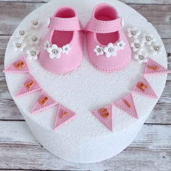 Handmade edible baby shoes cake topper