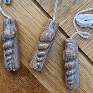 Handmade ceramic light pull decorated with a handmade shell