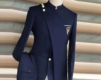 May include: A dark blue suit with a mandarin collar and gold buttons. The jacket has a single button closure and a decorative pocket on the left side. The suit is made of a smooth, tailored fabric.