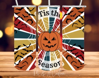 May include: Three stainless steel tumblers with a Halloween theme. The tumblers feature a retro-style design with a pumpkin, bats, and a spiderweb. The text on the tumbler reads "Tis the Season".