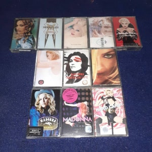 May include: A collection of 10 cassette tapes featuring Madonna albums. The albums include "Like a Prayer", "Immaculate Collection", "American Life", "Hard Candy", and "Music".