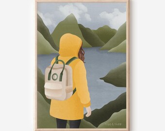 May include: A framed art print depicts a person in a yellow hooded jacket and backpack, gazing at a lake surrounded by green mountains. The artwork has a soft, illustrative style with a muted color palette, evoking a sense of tranquility and adventure.