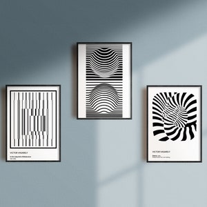 May include: Three black and white framed prints with geometric designs. The top print features a series of concentric circles. The left print features a series of vertical lines. The right print features a swirling pattern.