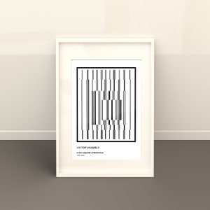 May include: Black and white geometric art print in a white frame. The print features a repeating pattern of vertical lines and squares. The artist's name, Victor Vasarely, and the title of the work, "In the Labyrinth of Modernism", are printed below the image.