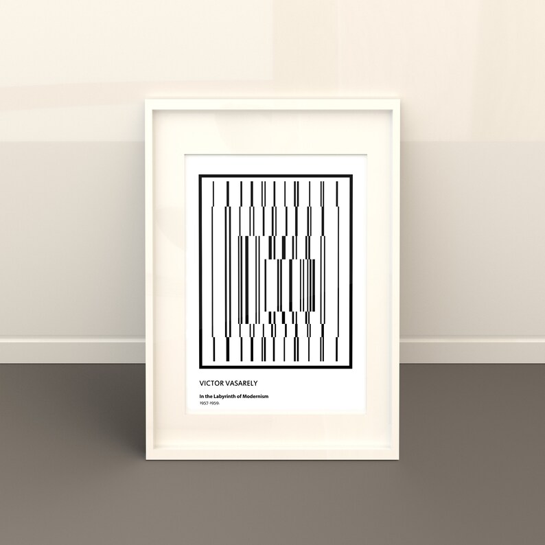 May include: Black and white geometric art print in a white frame. The print features a repeating pattern of vertical lines and squares. The artist's name, Victor Vasarely, and the title of the work, "In the Labyrinth of Modernism", are printed below the image.