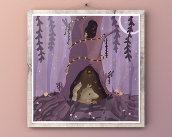 May include: A whimsical illustration of a forest scene with a tree hollow. A small, light-colored animal is nestled inside the hollow, illuminated by a lantern and string lights. The artwork is framed in a rustic, light-colored wooden frame.
