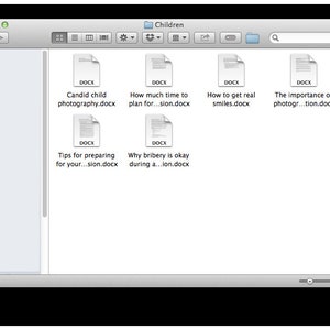 May include: A computer screen displaying a folder titled "Children" with several Microsoft Word documents, including "Candid child photography.docx", "How much time to plan for...sion.docx", "How to get real smiles.docx", "The importance of photogr...tion.docx", "Tips for preparing for your...sion.docx", and "Why bribery is okay during a...ion.docx".