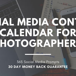 May include: A laptop computer, a smartphone, a pen, and a notebook with handwritten notes are on a wooden table. The notebook has the text "SOCIAL MEDIA CONTENT CALENDAR FOR PHOTOGRAPHERS" written on it. Below the text is a line and the text "365 Social Media Prompts 30 DAY MONEY BACK GUARANTEE".