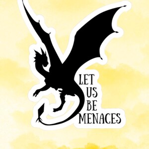 May include: A black dragon sticker with the text "LET US BE MENACES" on a yellow watercolor background. The dragon is silhouetted with outstretched wings and a long tail. The sticker has a white border.