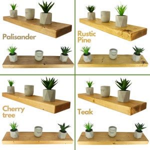 May include: Four wooden shelves with different wood finishes: Palisander, Rustic Pine, Cherry tree, and Teak. Each shelf is decorated with small potted plants and candles.