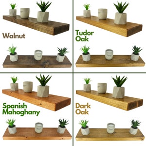 May include: Four wooden shelves in different wood stains: Walnut, Tudor Oak, Spanish Mahogany, and Dark Oak. Each shelf is decorated with three small potted succulents and a candle.