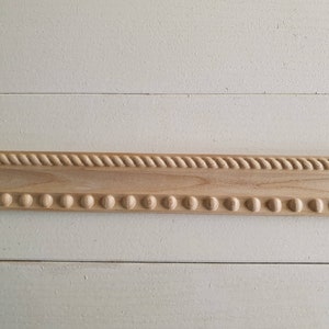 aus Holz geschnitztes Baguette