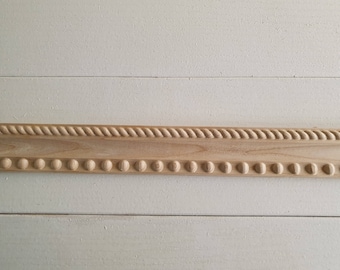 baguette de madera tallada