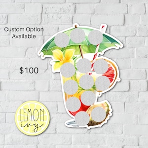 May include: A watercolour illustration of a glass of lemonade with a yellow flower, a green umbrella, and a red and white straw. The glass has 10 blank circles that can be used for a game or activity. The text "Custom Option Available" and "£100" are visible in the image. The text "LEMON ivy" is also visible in the image.