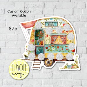 May include: A colorful vintage camper van with a floral design and glitter accents. The camper has a red awning and a ladder on the side. The text "SO-189 $75" is visible on the bottom of the camper.