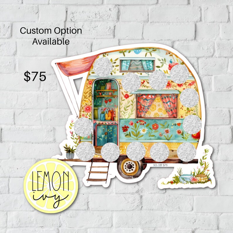 May include: A colorful vintage camper van with a floral design and glitter accents. The camper has a red awning and a ladder on the side. The text "SO-189 $75" is visible on the bottom of the camper.