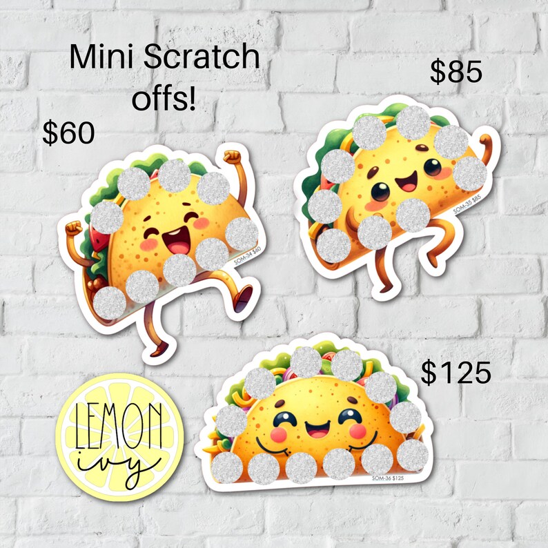 May include: Three colourful scratch-off cards shaped like smiling tacos. Each card has a different price: &pound;60, &pound;85, and &pound;125. The cards are on a white brick wall background. The text "Mini Scratch Offs!" is at the top of the image. The text "LEMON ivy" is in a yellow circle at the bottom of the image.
