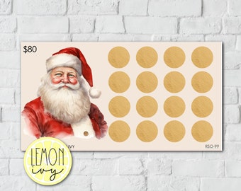 May include: A rectangular card featuring a watercolor illustration of Santa Claus in a red suit and hat, with a white beard. The card has 16 gold scratch-off circles and the text "$80". The Lemon Ivy logo is in the bottom left corner.