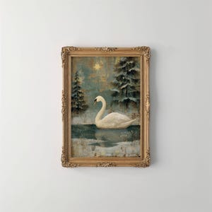 May include: A framed painting depicts a white swan on a lake, surrounded by snow-covered trees. The artwork has a vintage aesthetic with a gold-colored ornate frame. The background features a star and a teal and gold color palette, evoking a winter scene.