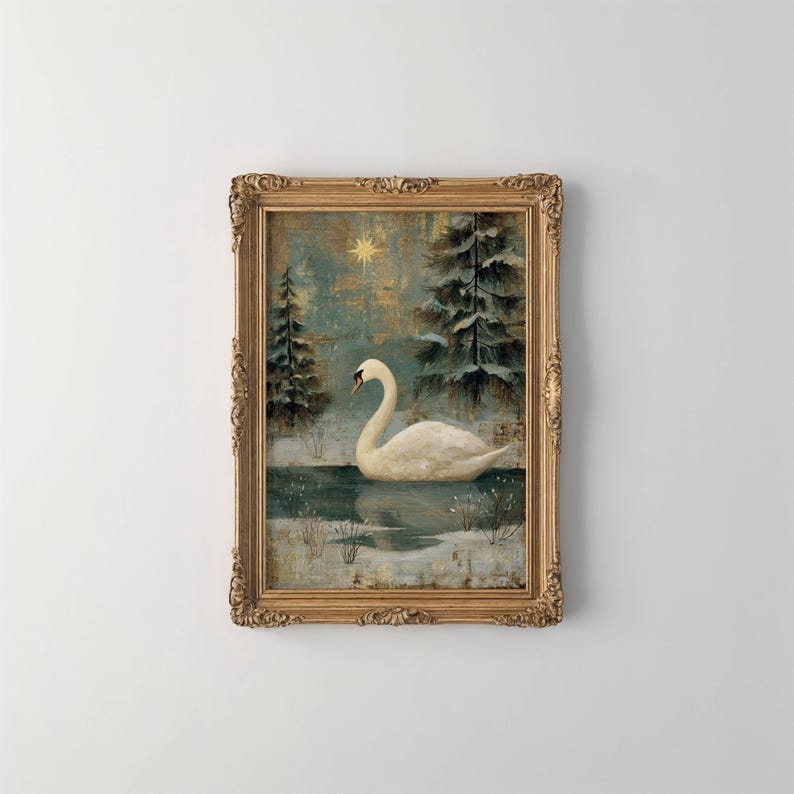 May include: A framed painting depicts a white swan on a lake, surrounded by snow-covered trees. The artwork has a vintage aesthetic with a gold-colored ornate frame. The background features a star and a teal and gold color palette, evoking a winter scene.