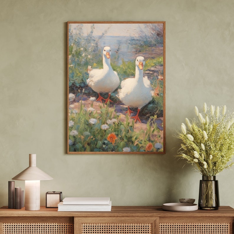 May include: A painting of two white ducks walking through a field of green grass and wildflowers. The ducks have orange beaks and legs. The background is a blurry blue sky and water.