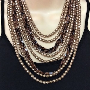 VTG Multi-Strand layered Goldtone Coated Faceted Glass Crystals and Polished Glass Agate Look Beads with Matching Clip on Earrings