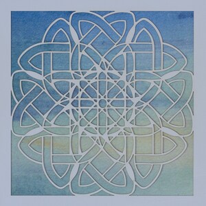 May include: A white paper cut-out design of a Celtic knot with a blue and green watercolor background.