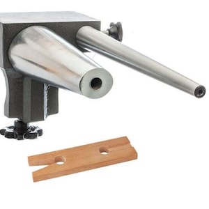 May include: A metal ring mandrel with a rotating base and two metal mandrels. The mandrel is used for shaping rings. A wooden ring sizing stick is also included.