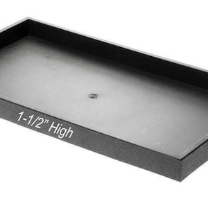 May include: Black rectangular display tray with a textured surface. The tray is 1-1/2 inches high.