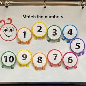 May include: A colourful caterpillar with numbers 1 through 10 on its segments. The caterpillar is on a white background with the text "Match the numbers".