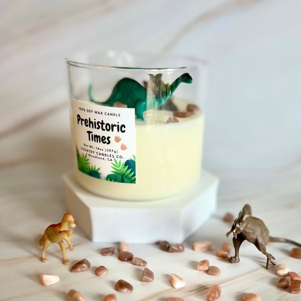 Prehistoric Times | Dinosaur Candle with Natural Sun Stone | 100% Soy Wax Candle | Patchouli Scent with Plastic Dinosaurs
