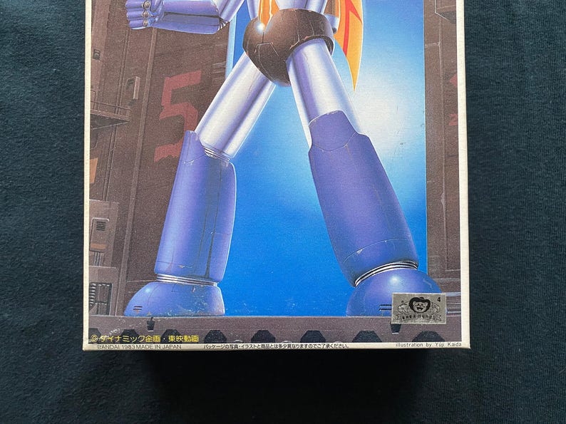 May include: A set of three ceramic mugs with a speckled, matte finish. The mugs are in shades of cream, light gray, and dark gray. Each mug has a simple, minimalist design and a rounded handle. The mugs are stacked on top of each other.