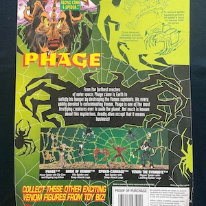 May include: A green, black, and red action figure packaging for a Spider-Man Venom character called Phage. The packaging features a cartoon image of the character and a description of the character's origin and abilities. The packaging also includes a list of other Venom figures available from Toy Biz.